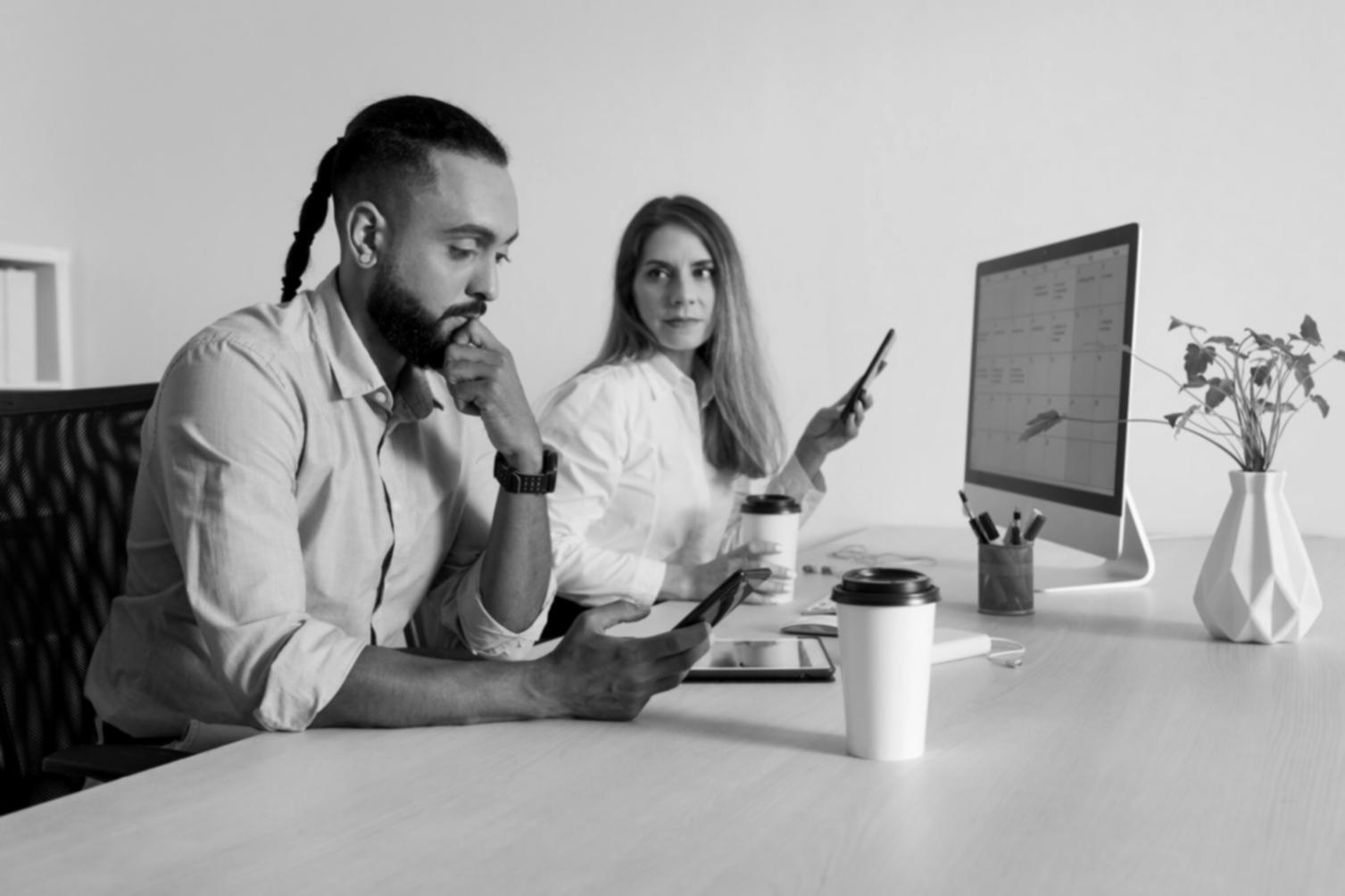 Collaborative workspace showing budget planning session with financial documents and strategic planning materials